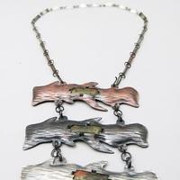 3 piece necklace with copper, a black metal, and a white metal